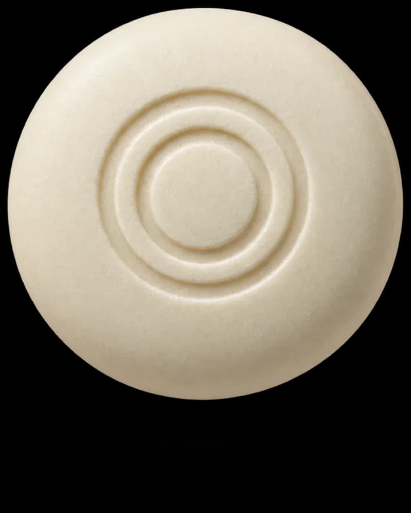 A round mint with a two-ring embossed logo