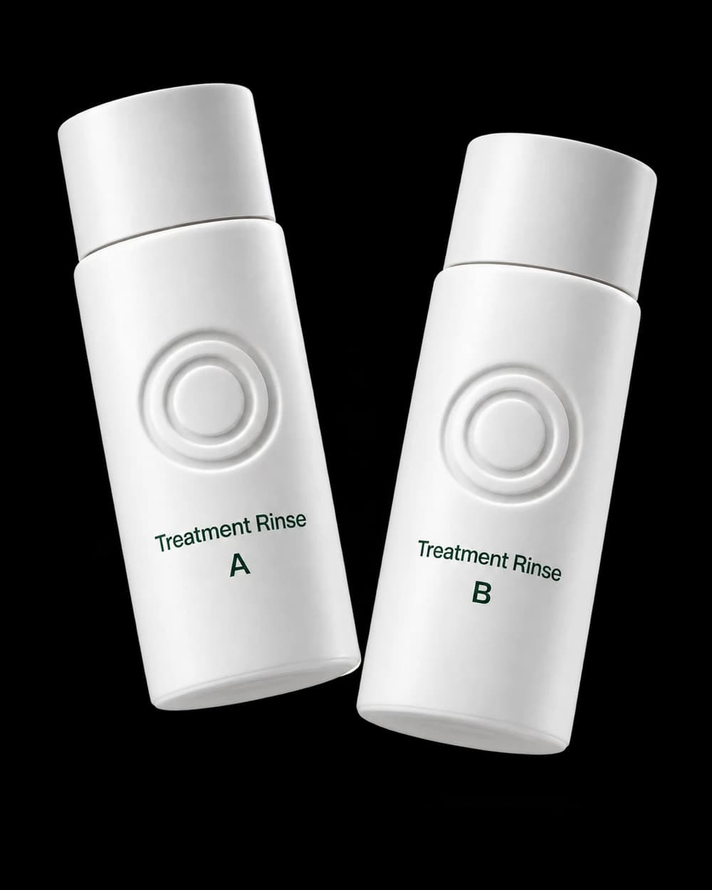 Two white Treatment Rinse bottles labeled A and B with embossed two-ring logos